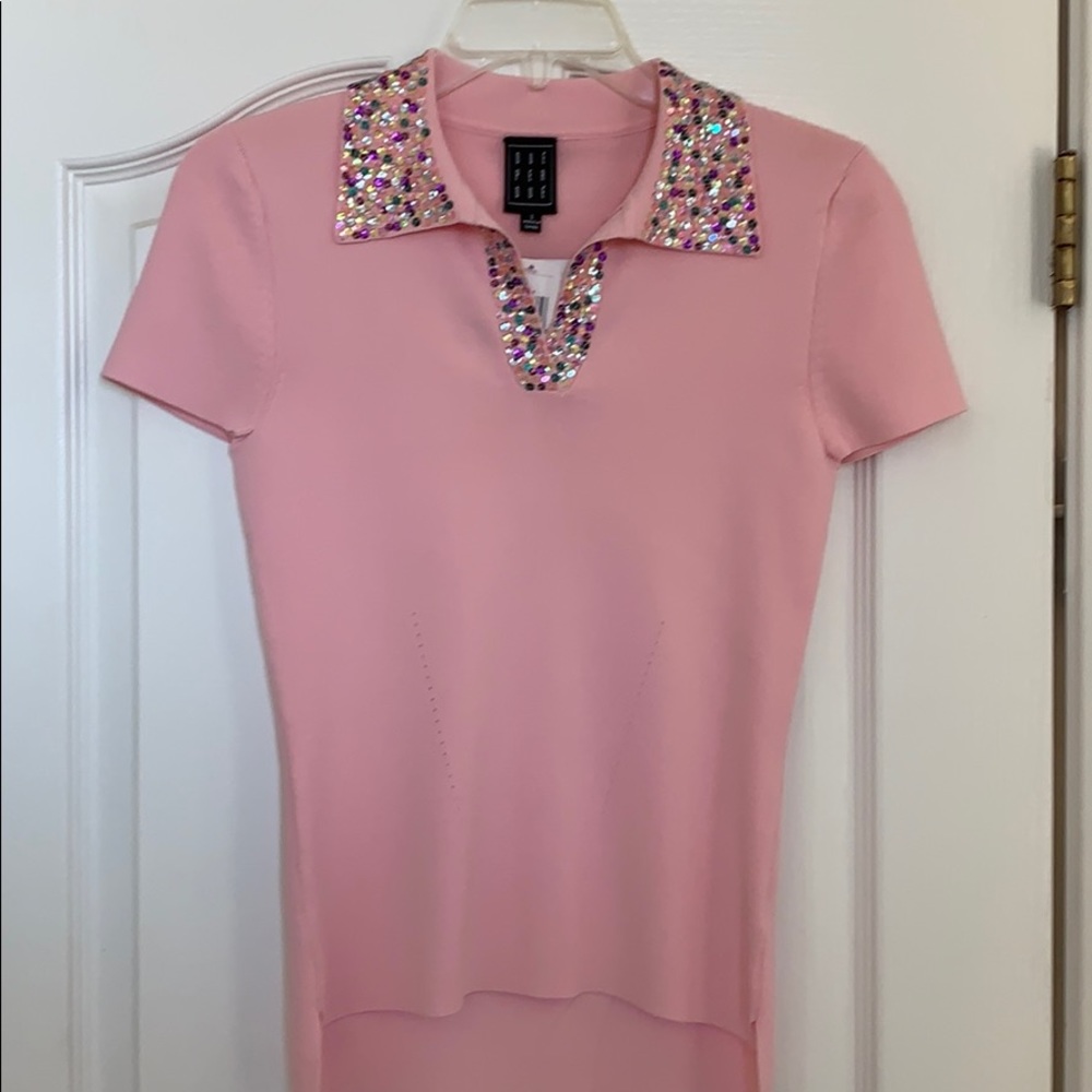 Pink knit tee with sequins.